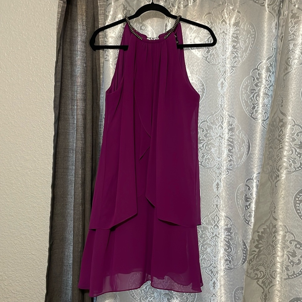 Cocktail dress only worn once. Size 10 Gorgeous neckline piece.